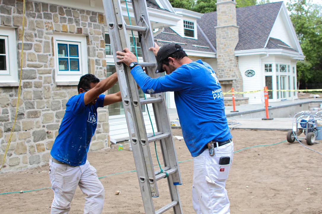 American Town Painting two crew ladder stone house