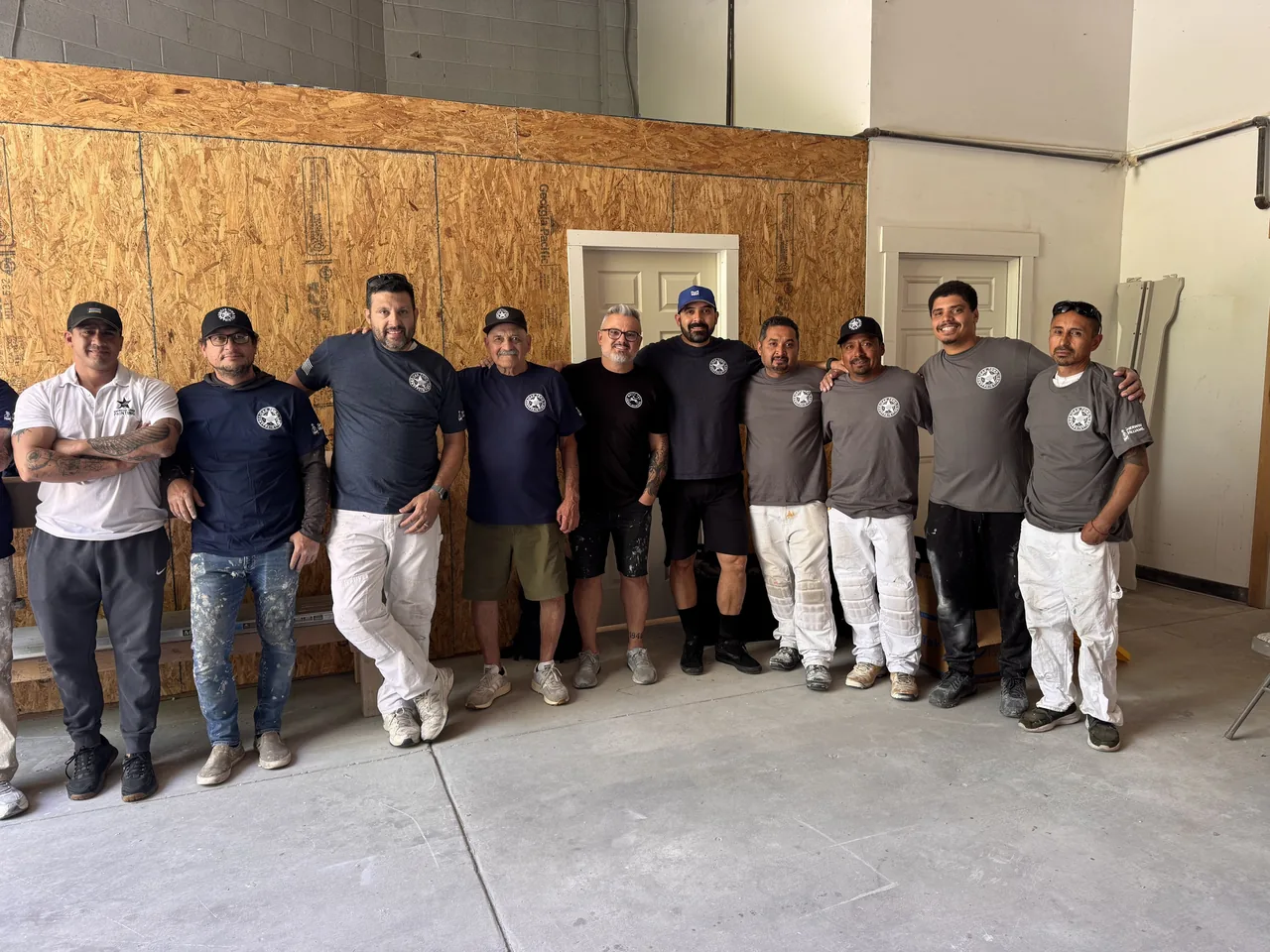 The American Town Painting crew in matching company shirts