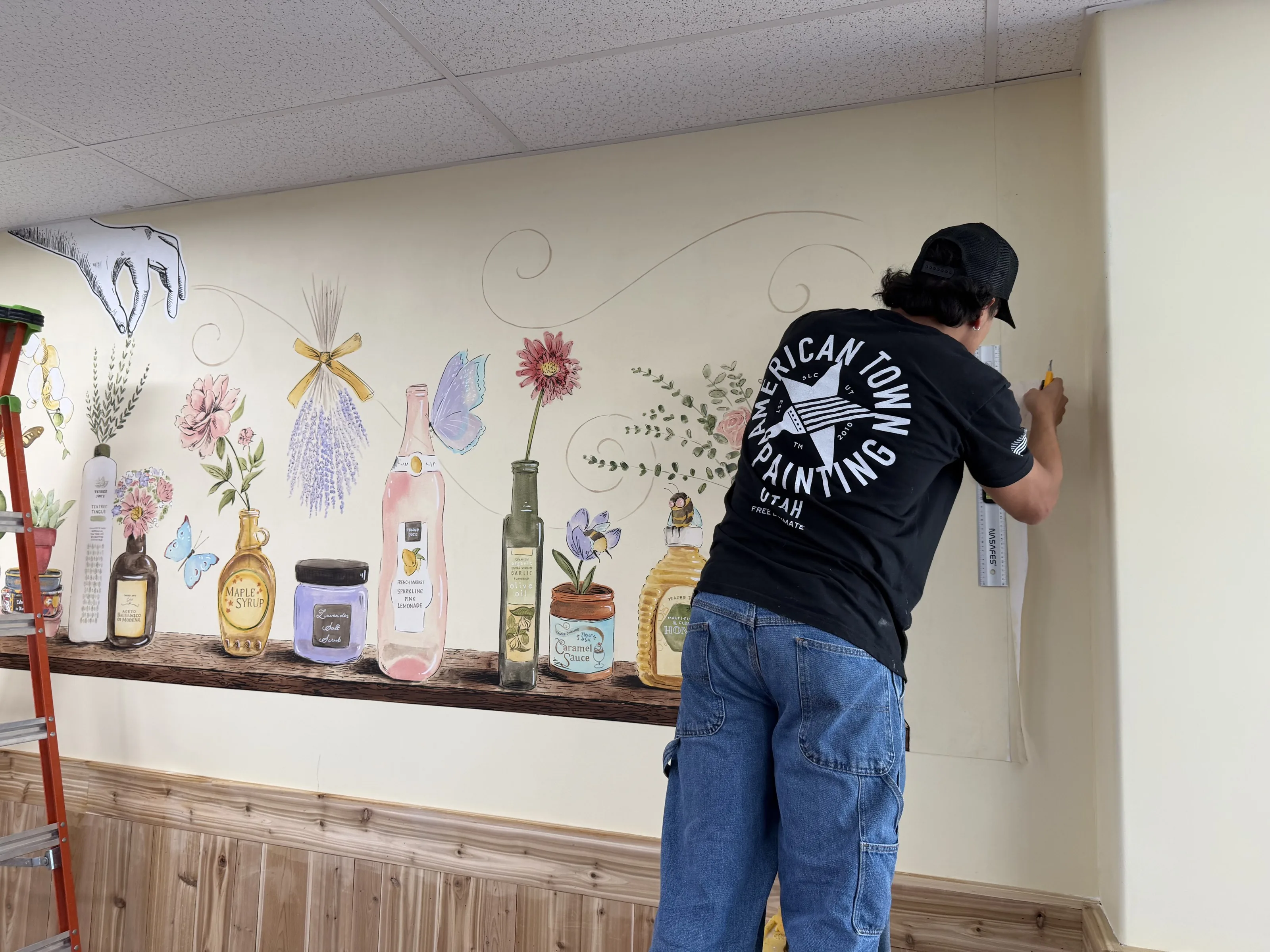 Crew installing wallpaper mural